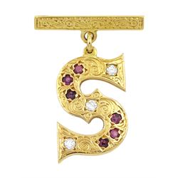 18ct gold round brilliant cut diamond and ruby 'S' pendant brooch, with engraved foliate decoration, stamped