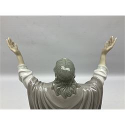 Lladro figure, The Loaves and Fishes, modelled as Jesus Christ with arms raised standing beside a basket of loaves and a basket of fish, sculpted by Salvador Furió, with original box, no 5896, year issued 1992, year retired 1997, H35cm