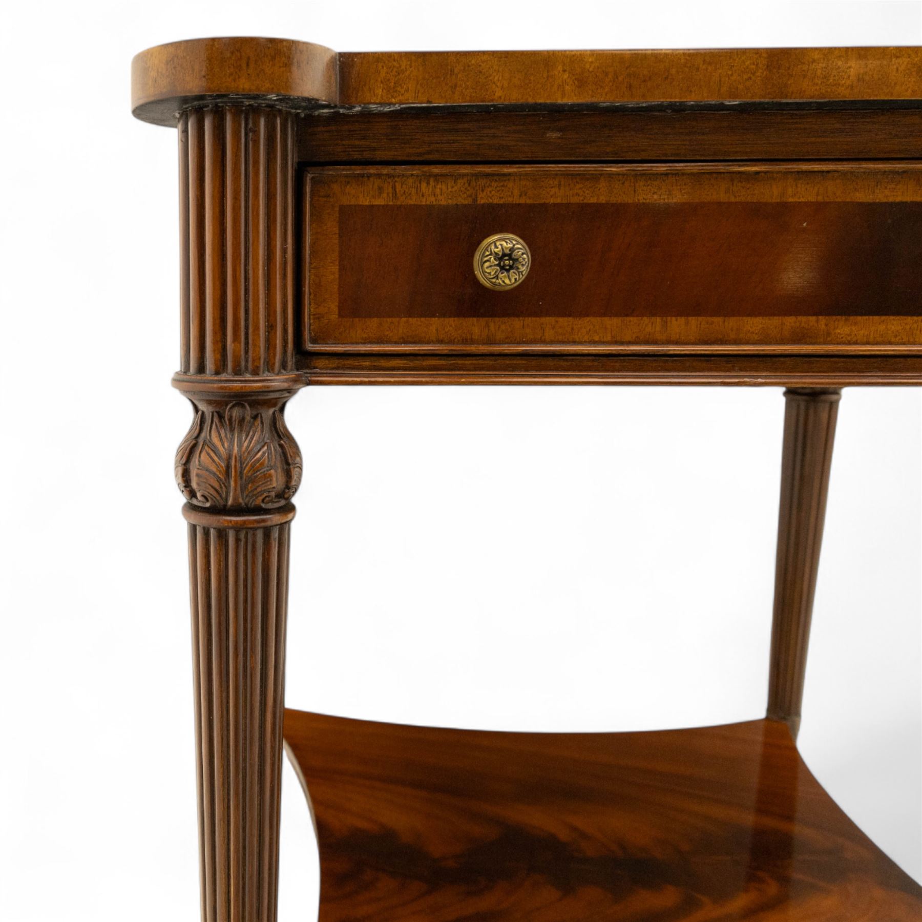 Maitland Smith - Pair of mahogany side tables, the rectangular top with rounded corners, the top edge inlaid with movingui wood, above two under-tier shelves, and frieze drawer, supported on stop-reed and acanthus foliate carved legs united by platform stretcher, raised on brass sabot foot caps