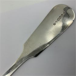 Victorian Newcastle silver Fiddle Shell pattern serving spoon, the terminal engraved with crest of a fist holding an arrow aloft, hallmarked Lister & Sons, Newcastle 1862, L31cm