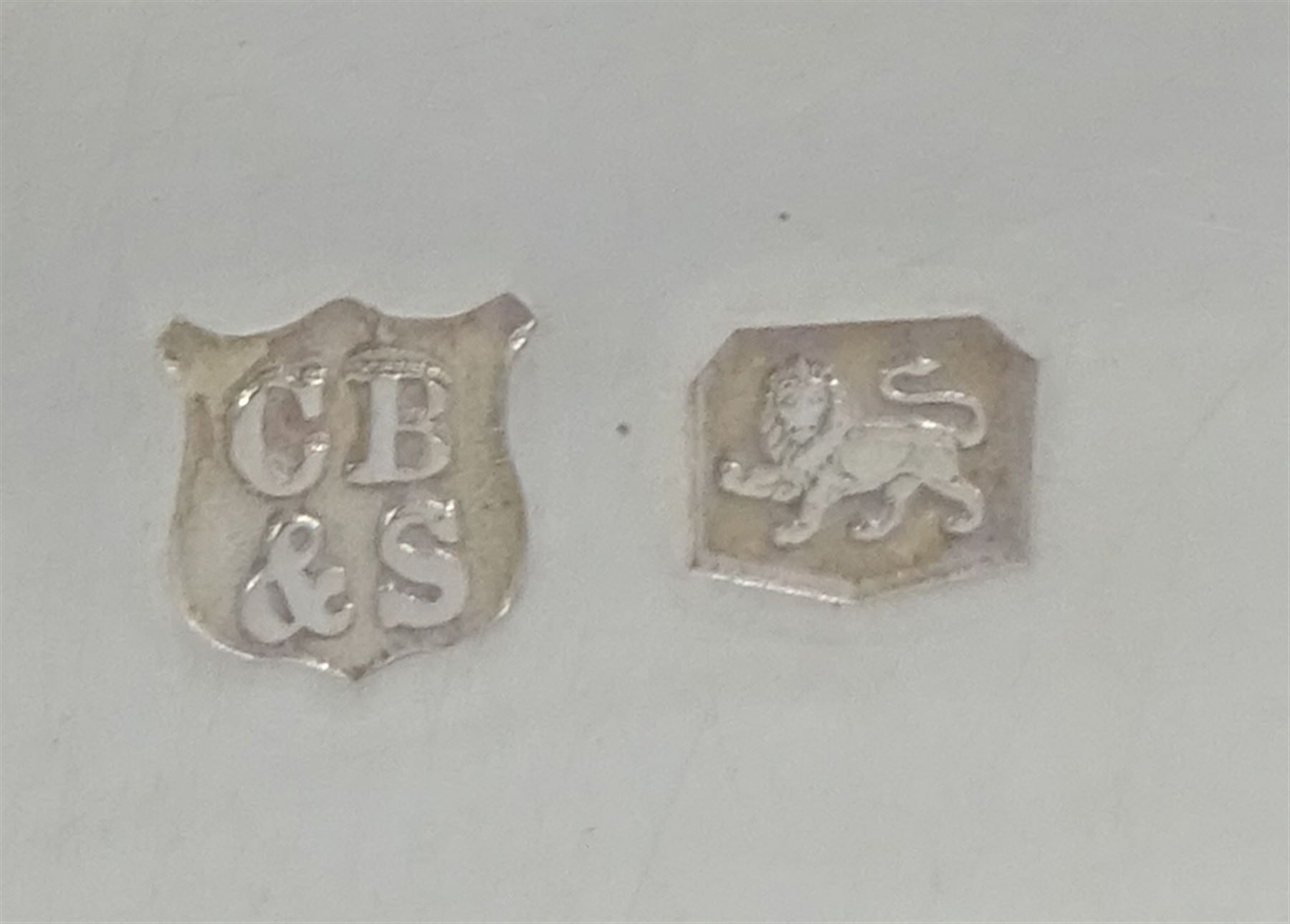 Raich Carter - presentation hallmarked silver two-handled tray of rounded oblong form with gadrooned rim by Wilson & Gill, 139 Regent Street, London, inscribed to the centre 'Presented to Mr. & Mrs. Raich Carter by the Lord Mayor of the City and County of Kingston-upon-Hull Alderman R.E. Smith J.P. on May 30th 1952on behalf of the many Admirers who subscribed to The Lord Mayor's Testimonial Fund in recognition of Raich Carter's genius as a footballer and his services to the City', London 1937 82oz L61cm; together with a hallmarked silver four-piece tea and coffee set by Cooper Bros. & Sons Ltd, the teapot of London shape with ebonised handle and knop, each piece engraved with an initial 'C', Sheffield 1920  60.5oz, teapot L29.5cm