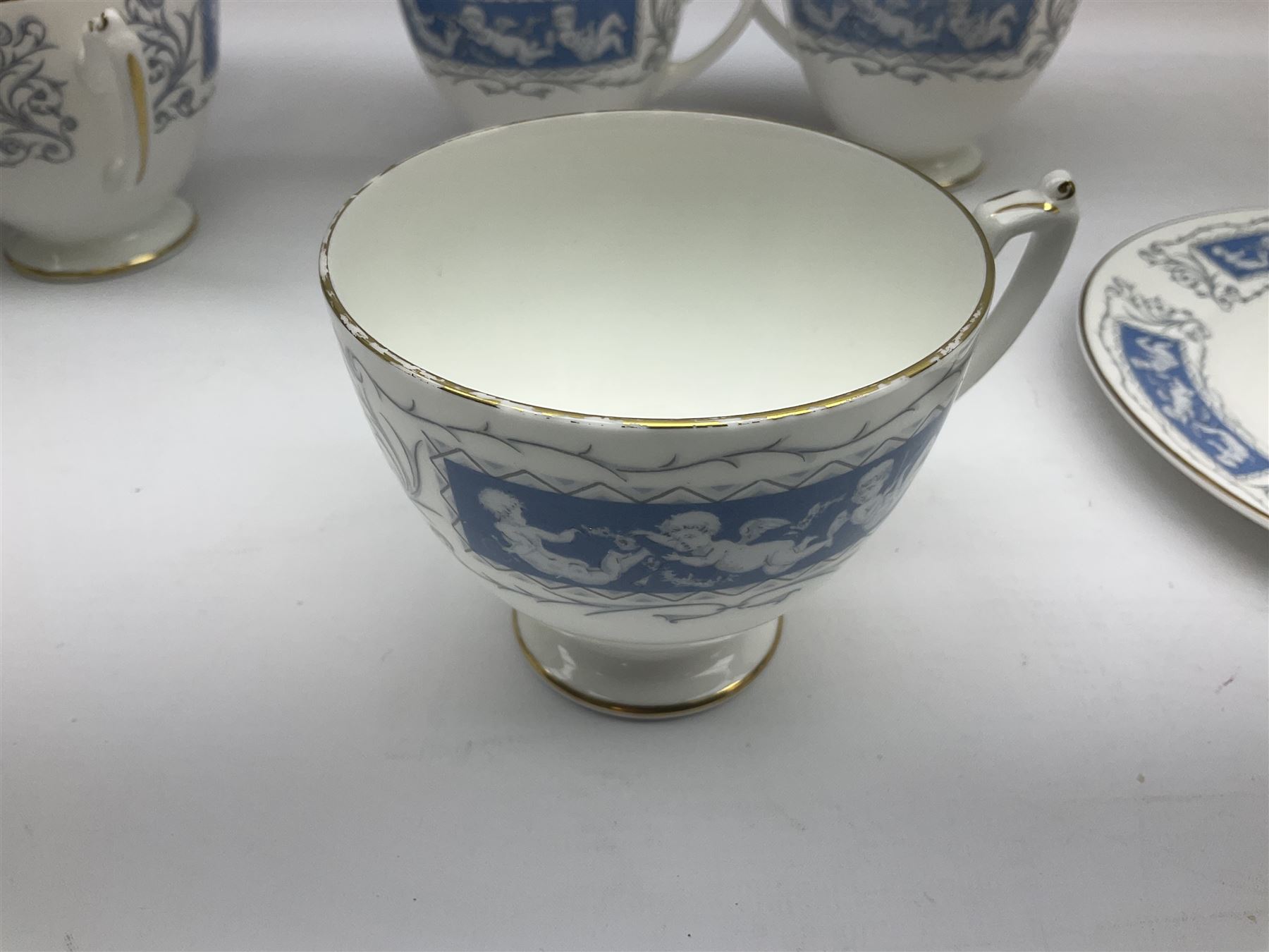 Coalport Revelry pattern tea and dinner wares, comprising nine dinner plates, four salad plates, eleven side plates, sauce boat and stand, ten teacups and ten saucers, and preserve pot and cover, together with a Coalport plate of shaped form decorated with pink roses, and a Royal Crown Derby Royal Antoinette pattern trio