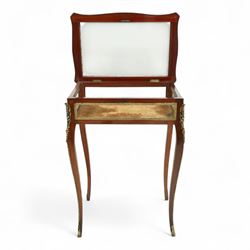 19th century, Louis XV style, bronze mounted bijouterie table, the hinged rectangular bevelled glass top with gilt bronze foliate beading, side glass panels  and plush-lined velvet interior, raised on cabriole legs, with gilt bronze masks and sabots