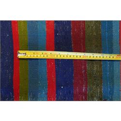 North East Persian Turkoman saddle bag, traditional double pouch form, each panel woven with vertical bands of small geometric motifs on ivory ground, framed by multiple horizontal borders of angular tribal ornament of hooked devices and steeped lozenges, reverse with stripped coloured flatweave bands 