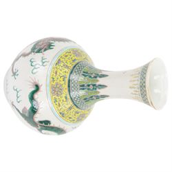 Pair 20th century Chinese famille verte bottle vases, each decorated with green and purple dragons chasing pearls amidst auspicious flames, the neck with yellow and green stylised foliate and cell borders, and the white glazed body incised throughout with fan shapes, each with red character mark beneath flanked by green dragons, H38cm

