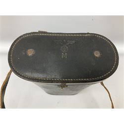 Pair of WWII German U-boat binoculars probably 7 x 50 by Leitz, with rubber eye piece protector covers and leather case stamped with Kriegsmarine mark to the lid and dated 1944, with leather strap.