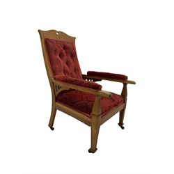 Early 20th century Arts & Crafts oak armchair, upholstered in red cover with raised foliate pattern