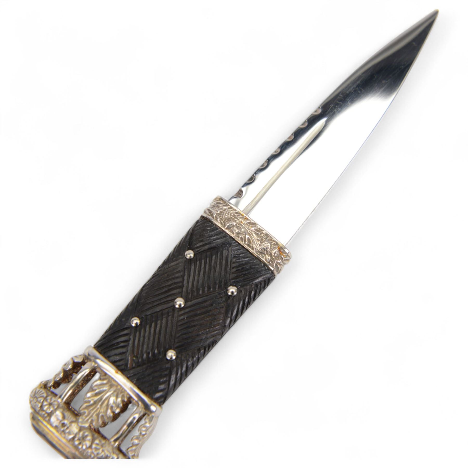 Skean dhu, the 9cm blade with scalloped back edge, with ebonised hilt and stone pommel, in its leather covered sheath with silver collar, hallmarked 1987, together with two other skean dhu  