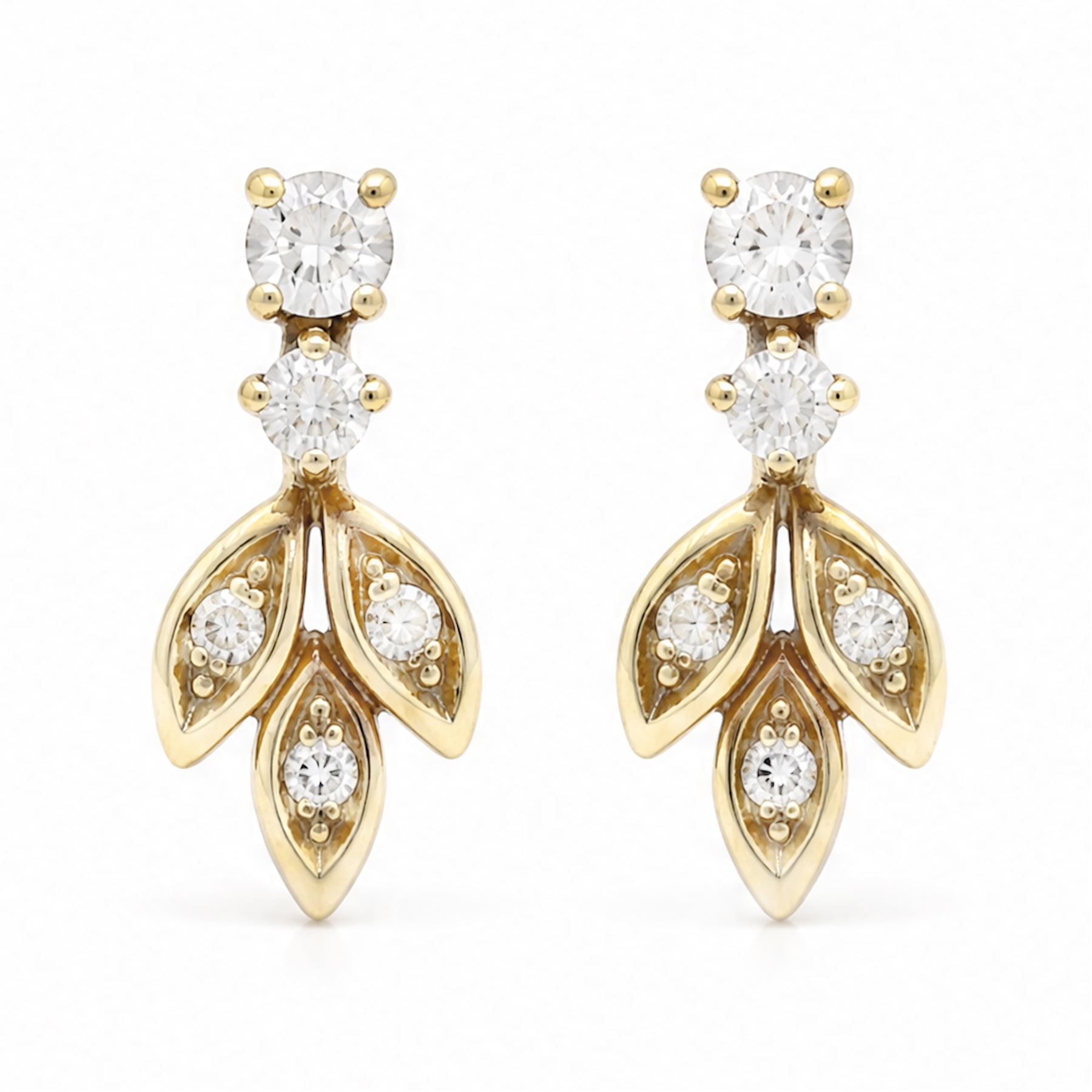 Pair of 18ct gold diamond leaf design earrings, each stud with diamond set leaves, suspending from two round brilliant cut diamonds, Sheffield import mark 1989, total diamond weight approx 0.40 carat