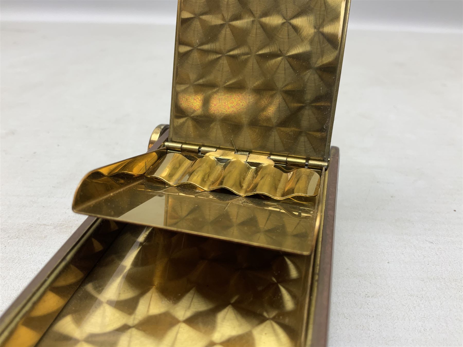 Art Deco camera shaped lady's musical compact and cigarette case, probably German, with green marble effect panels and gilt highlights, with large hinged opening to reveal engine turned brass interior with cigarette or lipstick holders, and the other side with musical mechanism and flip action powder compartment with mirror, L10cm