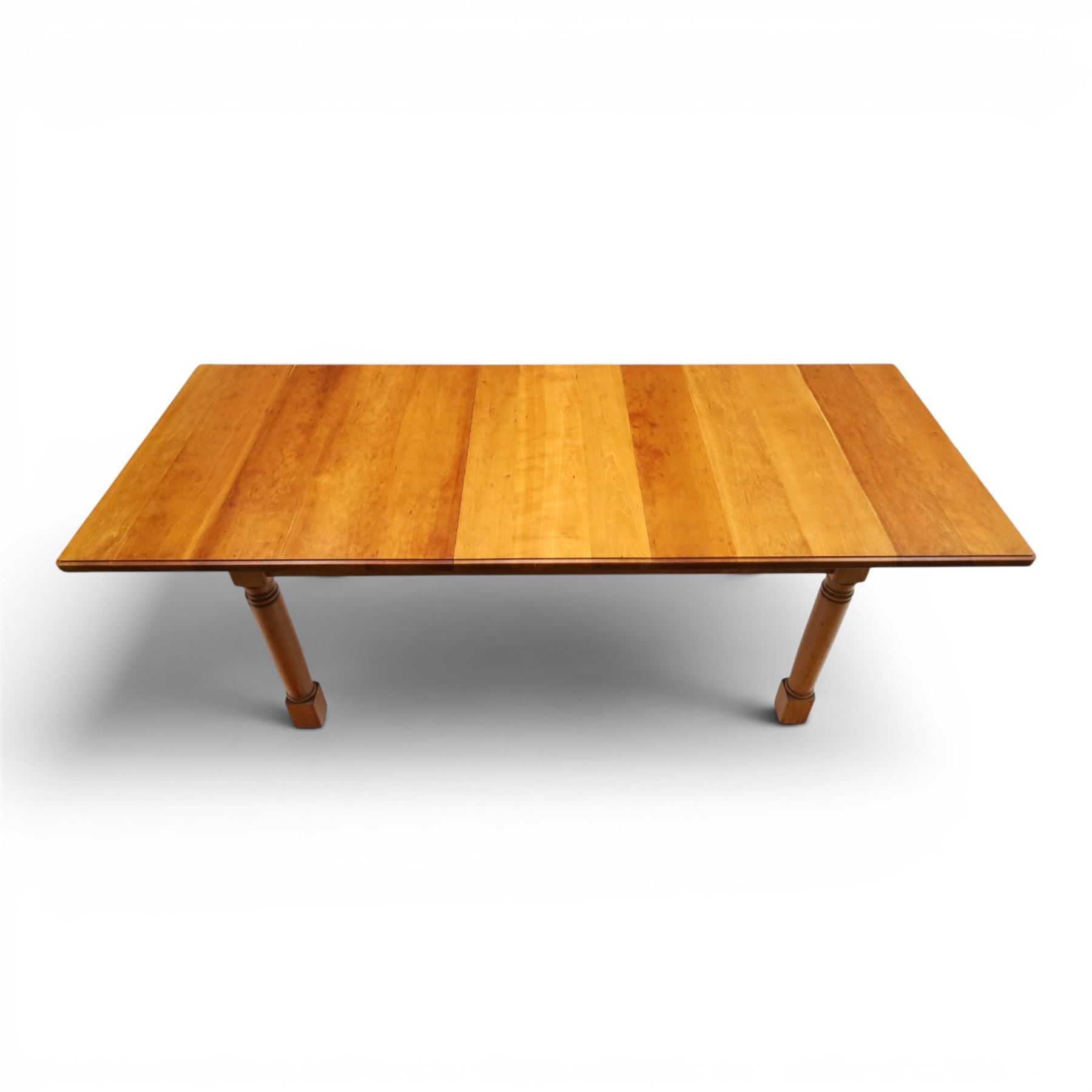 Knightman - cherrywood extending dining table, the rectangular top raised on four turned legs, with additional leaf extending to 230cm total, recessed carved knight trademark, by Horace Knight of Old Mill Furniture, Balk near Thirsk