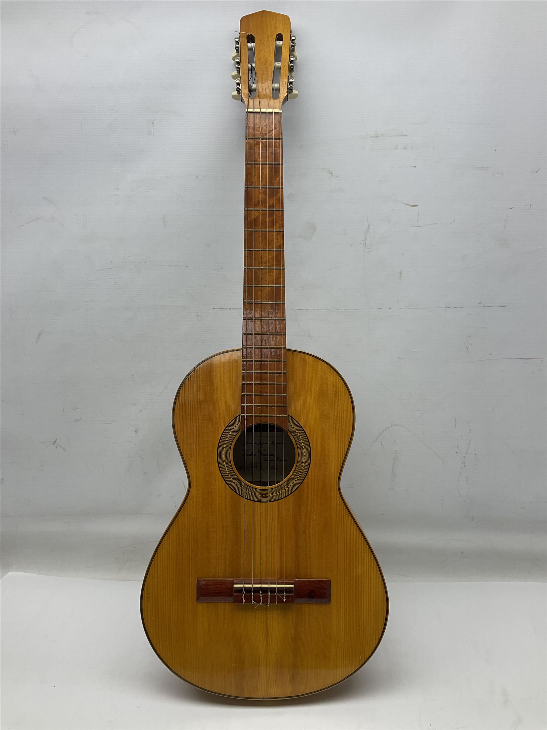 Encore black electric cut-away guitar L96cm; and Spanish Victor Garcia model 187 acoustic guitar, bears label dated 1972 L99cm; each in soft carrying case (2)