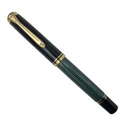 Pelikan M800 Souveran fountain pen, the green and black striped barrel with gilt beak shaped clip and double cap band with gold bi-colour nib stamped 18C-750, L13.5cm