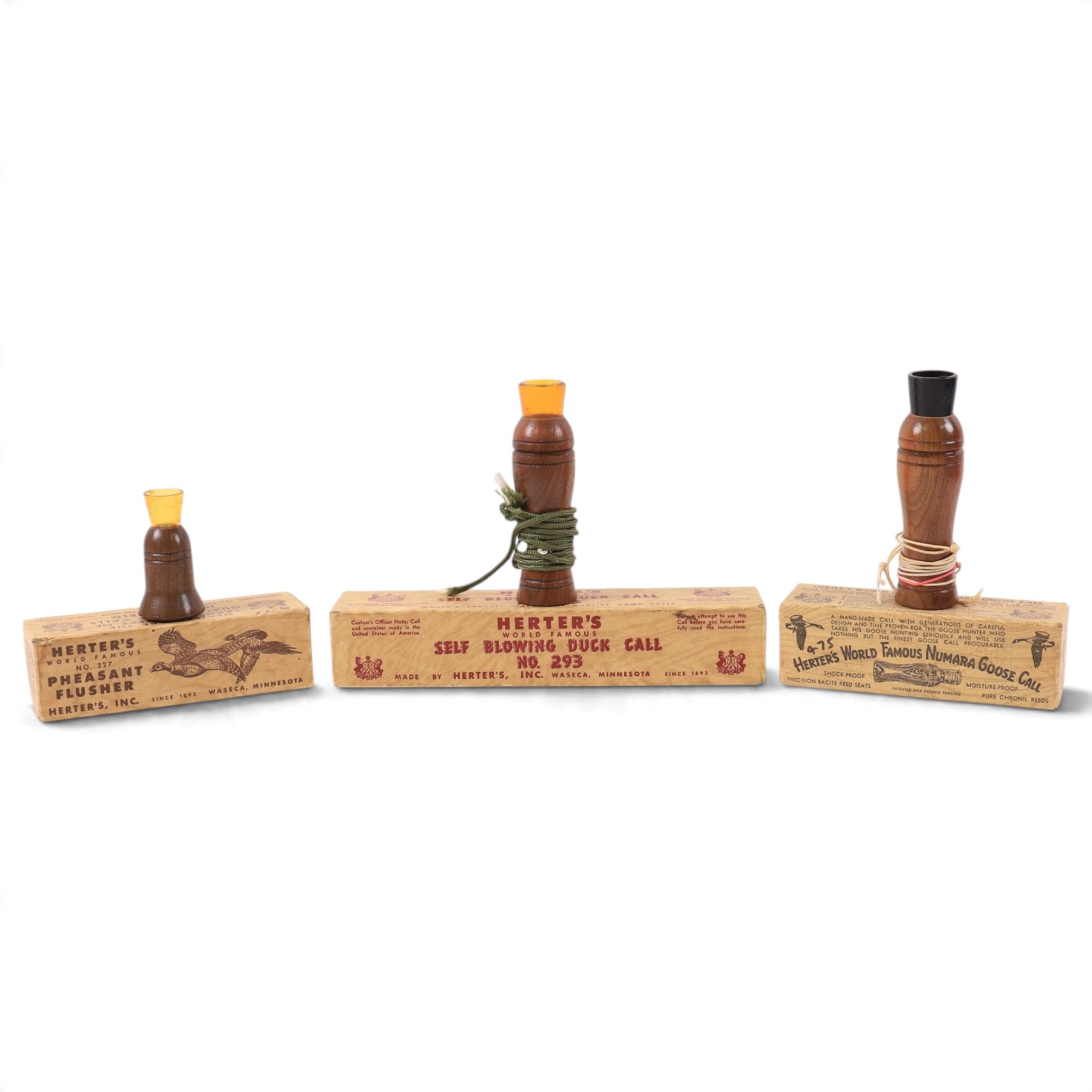 Three Herter's World Famous bird calls, comprising Pheasant Flusher, Self Blowing Duck Call and Numara Goose call, all boxed