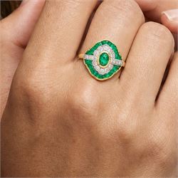 18ct gold emerald and diamond dress ring, single oval cut emerald, with single cut diamond and calibre cut emerald surround, total diamond weight approx 0.35 carat, total emerald weight approx 0.65 carat