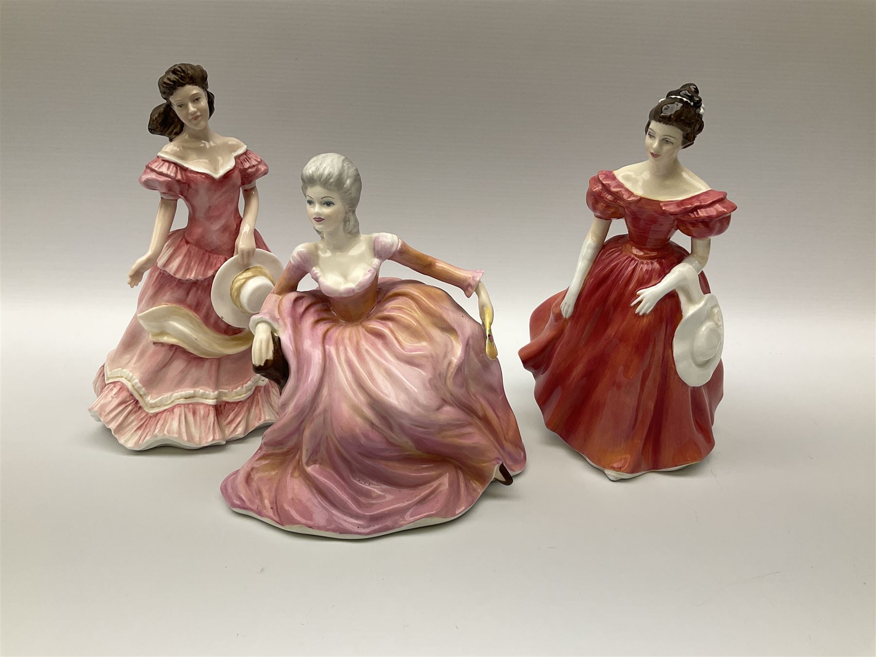 A group of eight Royal Doulton figures, comprising Simone HN2378, Amy HN3854, Fragrance HN2334, Louise HN3207, Adrienne H2304, Michele HN2234, Fine Lady HN2193, Winsome HN2220 and a Coalport figure, Polly. 