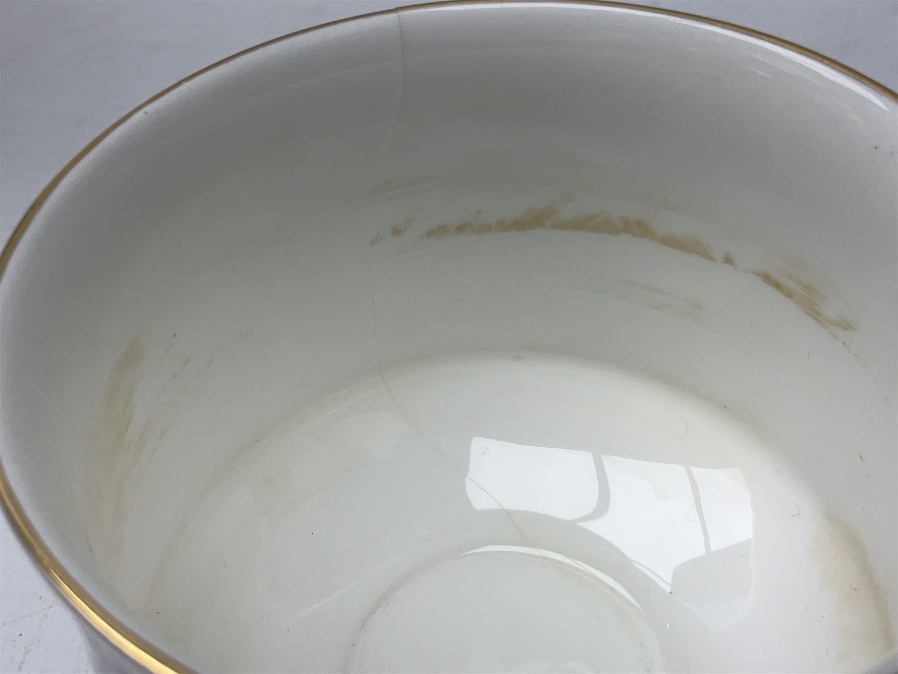 Royal Albert Paragon tea and dinner service for twelve decorated in the Belinda pattern, comprising fourteen saucers, twelve teacups, thirteen side plates, teapot, sauce boat and stand, salt and pepper shakers, two jugs, sucrier, twelve dinner plates, twelve smaller plates, two lidded tureens, twelve bowls, twelve smaller bowls, cake plate, oval plate and oval dish (100)