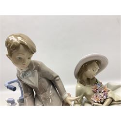 Lladro figure, Country Ride, modelled as a boy on a bike and a seated girl with flowers, sculpted by Francisco Polope, no 5958, with original box, year issued 1993, year retired 2004, H29cm