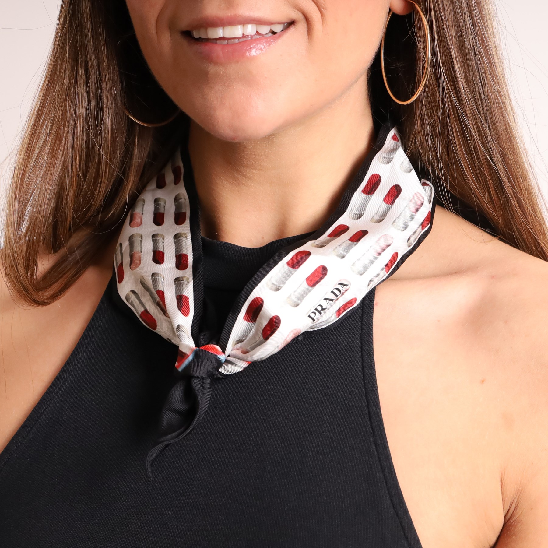 Prada - silk twill skinny scarf, decorated with repeating lipstick motif in red, pink and grey, with black border
