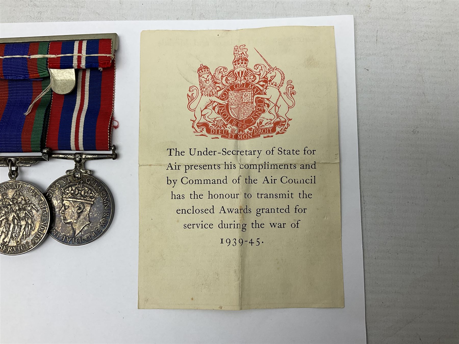 WW2 group of five medals comprising 1939-1945 War Medal, Defence Medal, 1939-1945 Star, France and Germany Star and Canadian Volunteer Service Medal; on wearing bar with ribbons; with a medal box and slip and three photographs