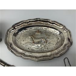 Silver plated tray, with shaped rim and embossed with a dog and crown to centre, stamped Valenti, together with three silver plated decanter labels, two port and one Bucellas, a plated cream jug with embossed floral decoration and a pair of plated fish knives engraved with double headed eagle to handle, tray W25.5
