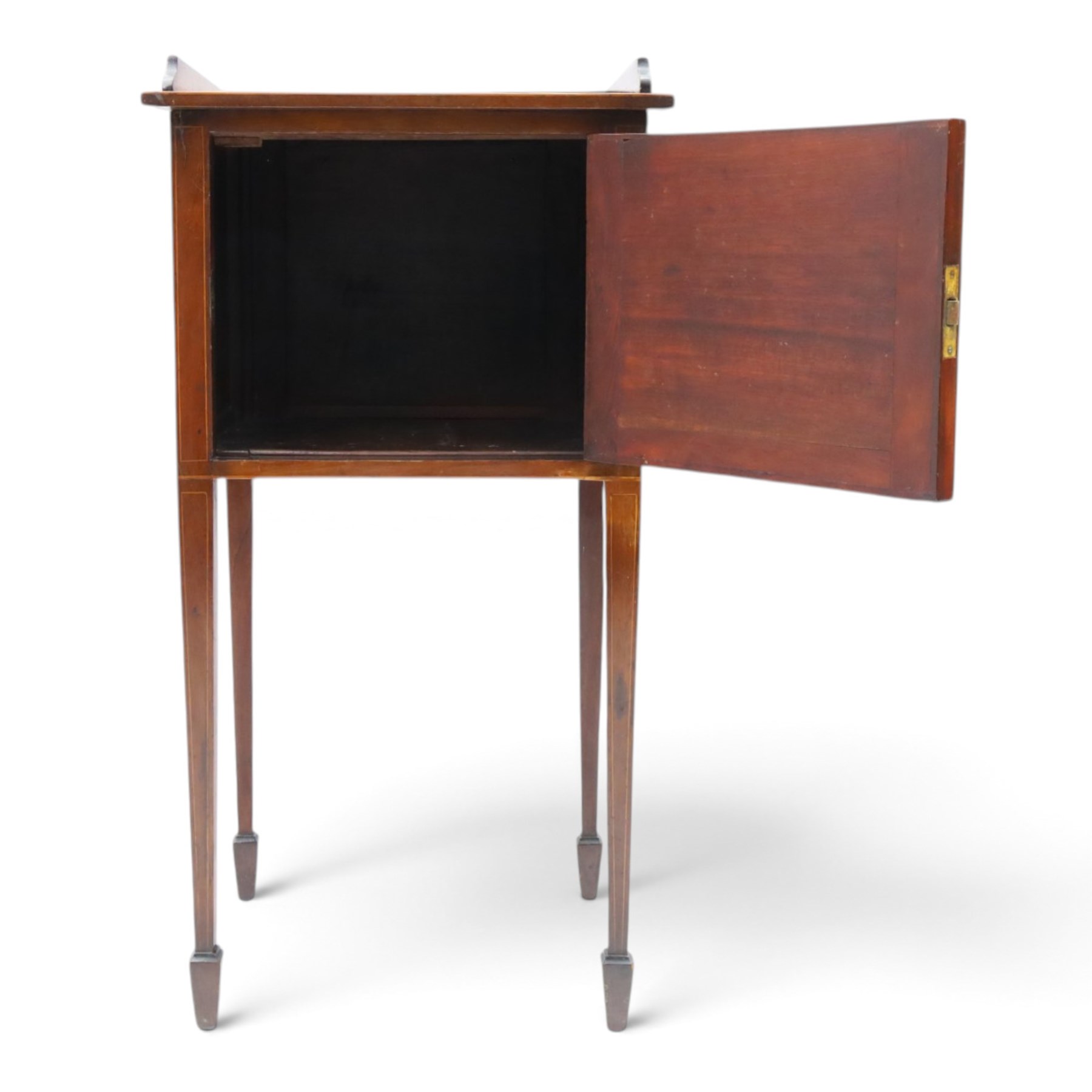Edwardian mahogany pot cupboard, with three quarter galleried top, single cupboard door, raised on square tapering supports terminating in spade feet