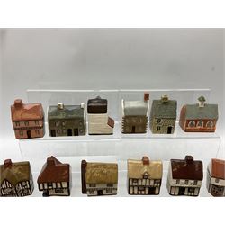 Twenty studio pottery figures of houses and cottages, comprising seventeen Mudlen End Studio Felsham Suffolk examples and two John Putman's Heritage Houses examples