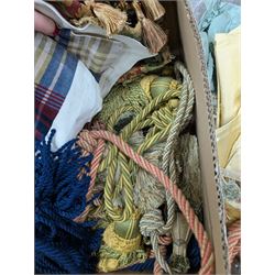 Collection of curtain fabric pieces and tassels