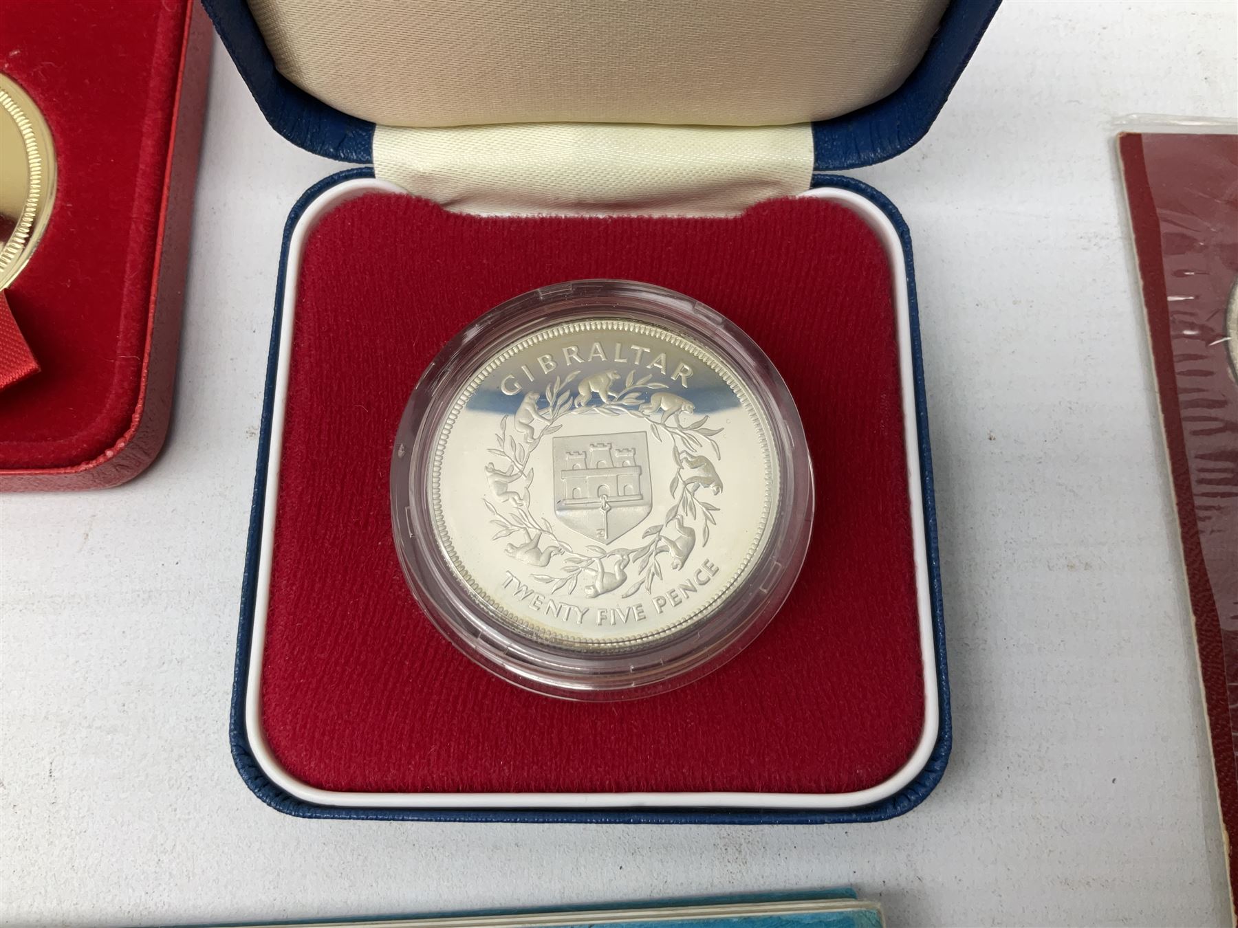 Great British and World coins, including Canadian 1975 dollar, United States of America 1975 proof set and bicentennial silver uncirculated set 1776-1976, Queen Elizabeth II Gibraltar 1977 sterling silver proof twenty-five pence, cased with certificate, New Zealand 1979seven coin set in blue wallet,  GB pre-decimal coins etc