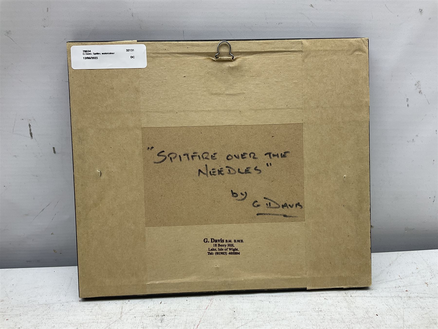 G Davis (British 20th century): 'Spitfire over the Needles', watercolour signed, titled verso 6cm x 9cm