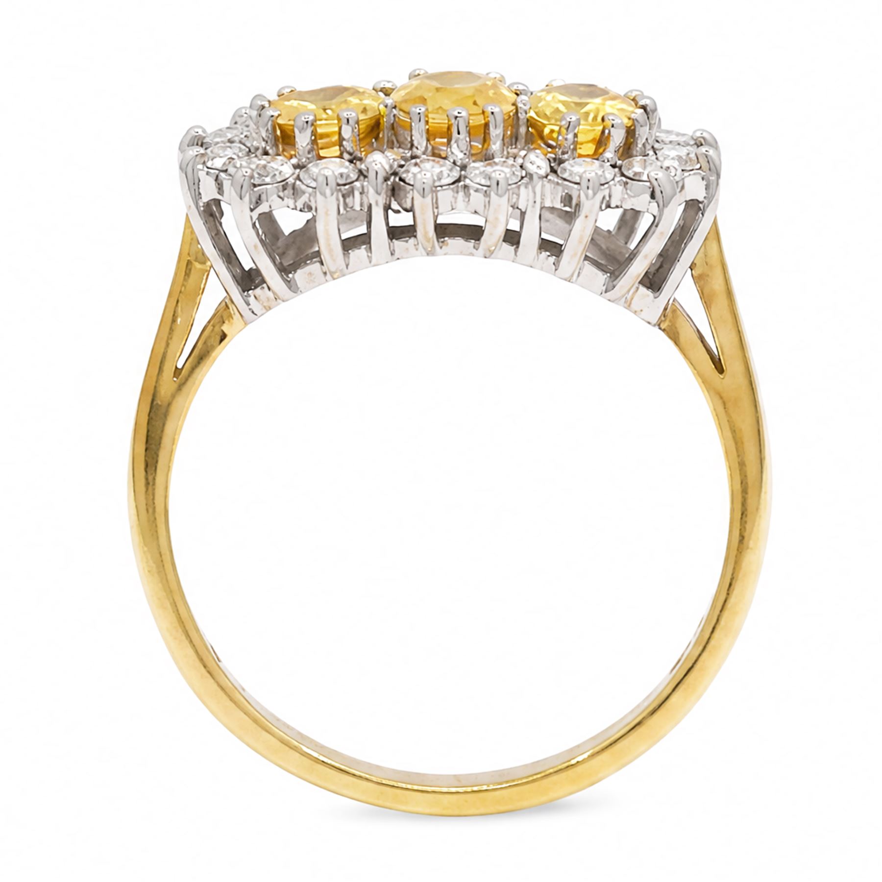 18ct gold yellow sapphire and diamond cluster ring, three oval cut sapphires, surrounded by twenty round brilliant cut diamonds, London 1988, total sapphire weight approx 1.15 carat, total diamond weight approx 0.50 carat