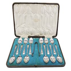 Set of twelve Edwardian silver teaspoons and a pair of matching sugar tongs, with engraved scrolling pattern to handles, hallmarked John Sanderson, Sheffield 1908, contained within a tooled leather silk and velvet lined fitted case