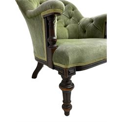 Victorian mahogany framed armchair, upholstered in buttoned sage green fabric with sprung seat, raised on turned and fluted front supports with matching arm terminal column supports