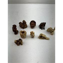 Nine wooden and composite carved netsukes, to include dog, horse and monkey, female figure etc 