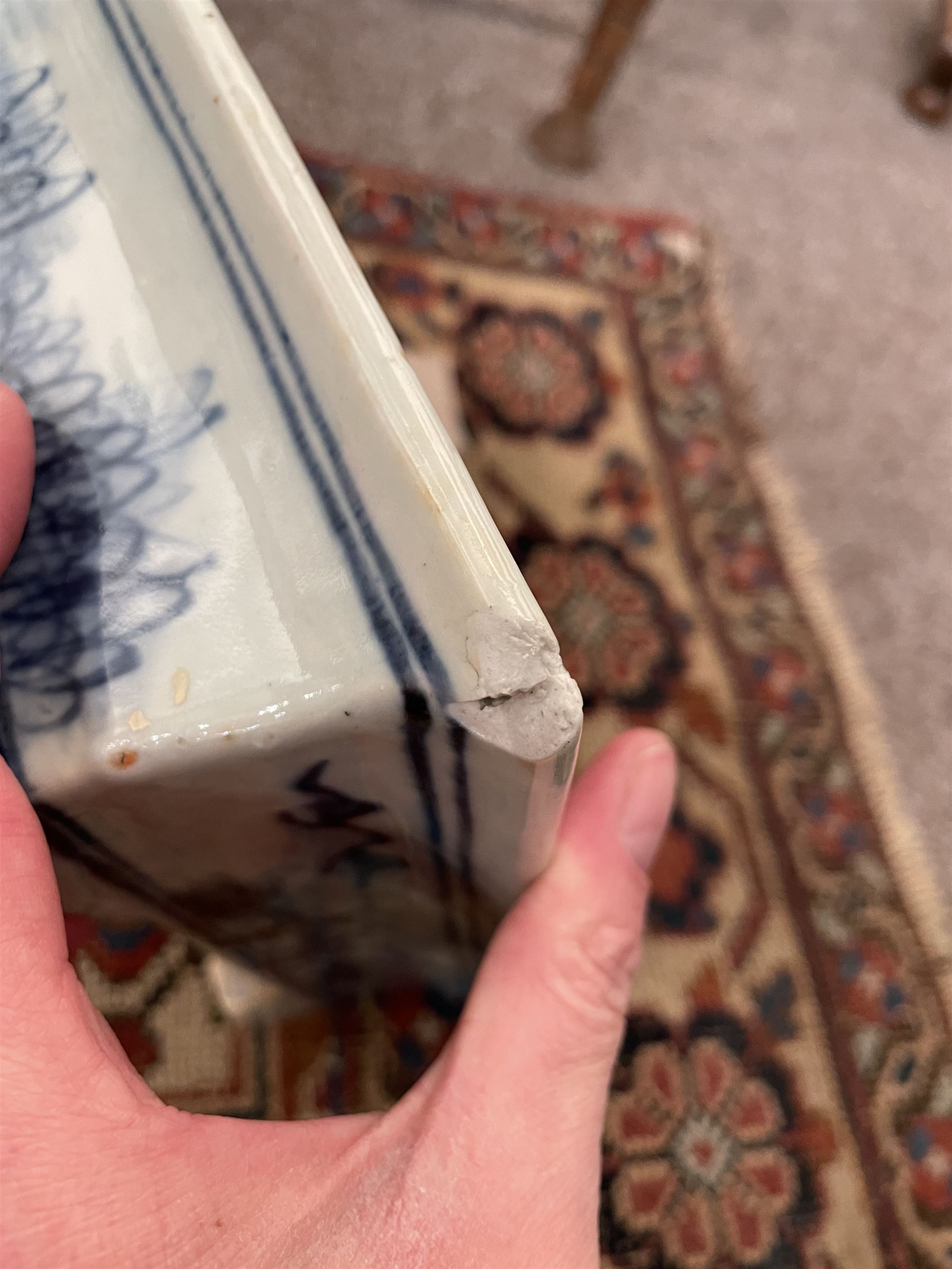 19th century Chinese blue and white planter and stand, each of square slightly tapering and flared form, the planter decorated with figures and precious objects between stylised foliate borders, the stand decorated with landscapes beneath a lipped rim with cell band, planter H28cm D25.5cm, stand H7cm D26cm