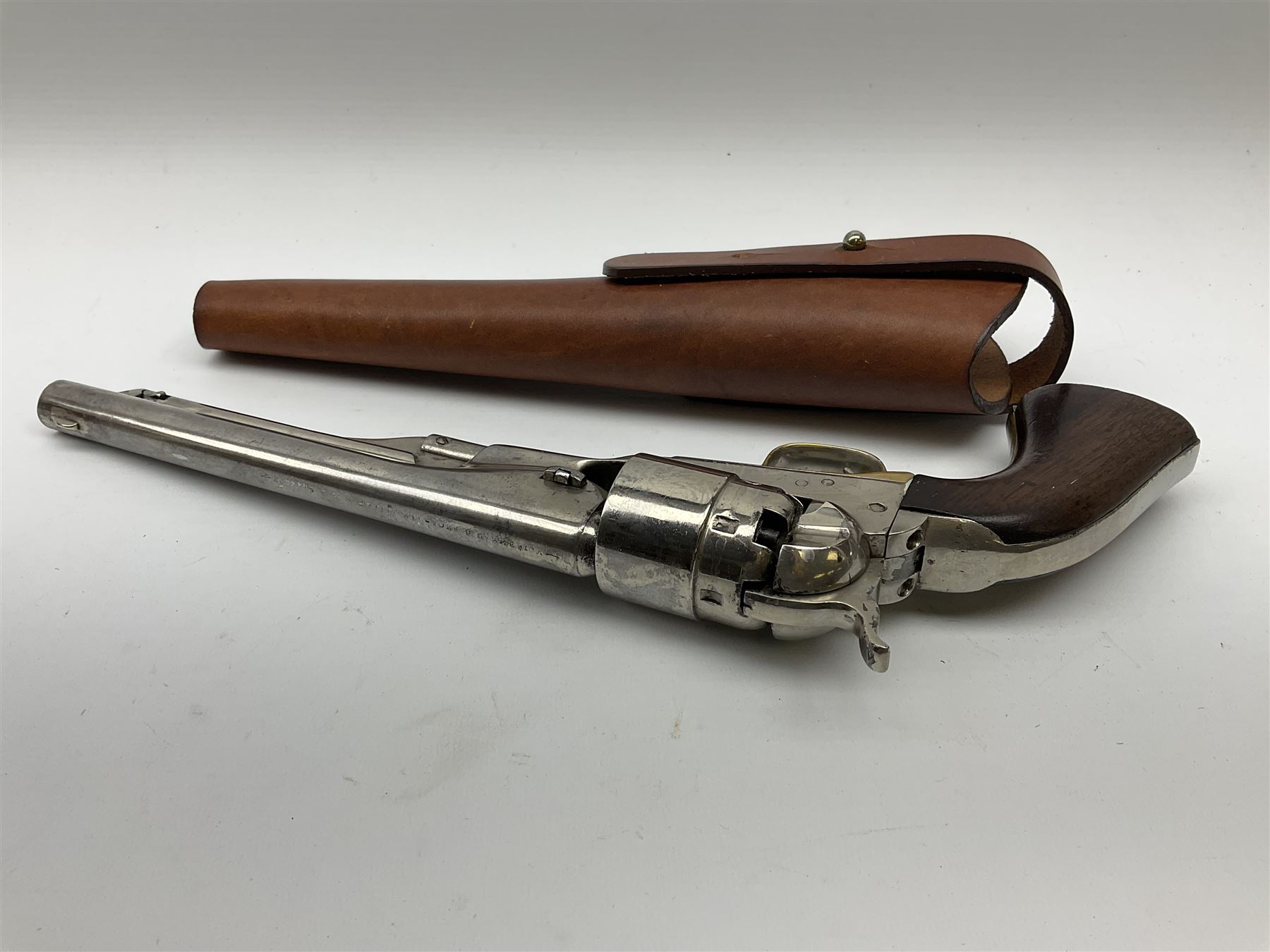 Colt model 1860 .44 calibre six-shot percussion army revolver with stepped cylinder, the 20.5cm barrel inscribed 'Address Col Saml Colt New York US America' with under barrel rammer, all parts with matching serial no.77902, traces of plating to brass trigger guard, two-piece walnut grips L37cm; with modern brass bullet maker and leather holster