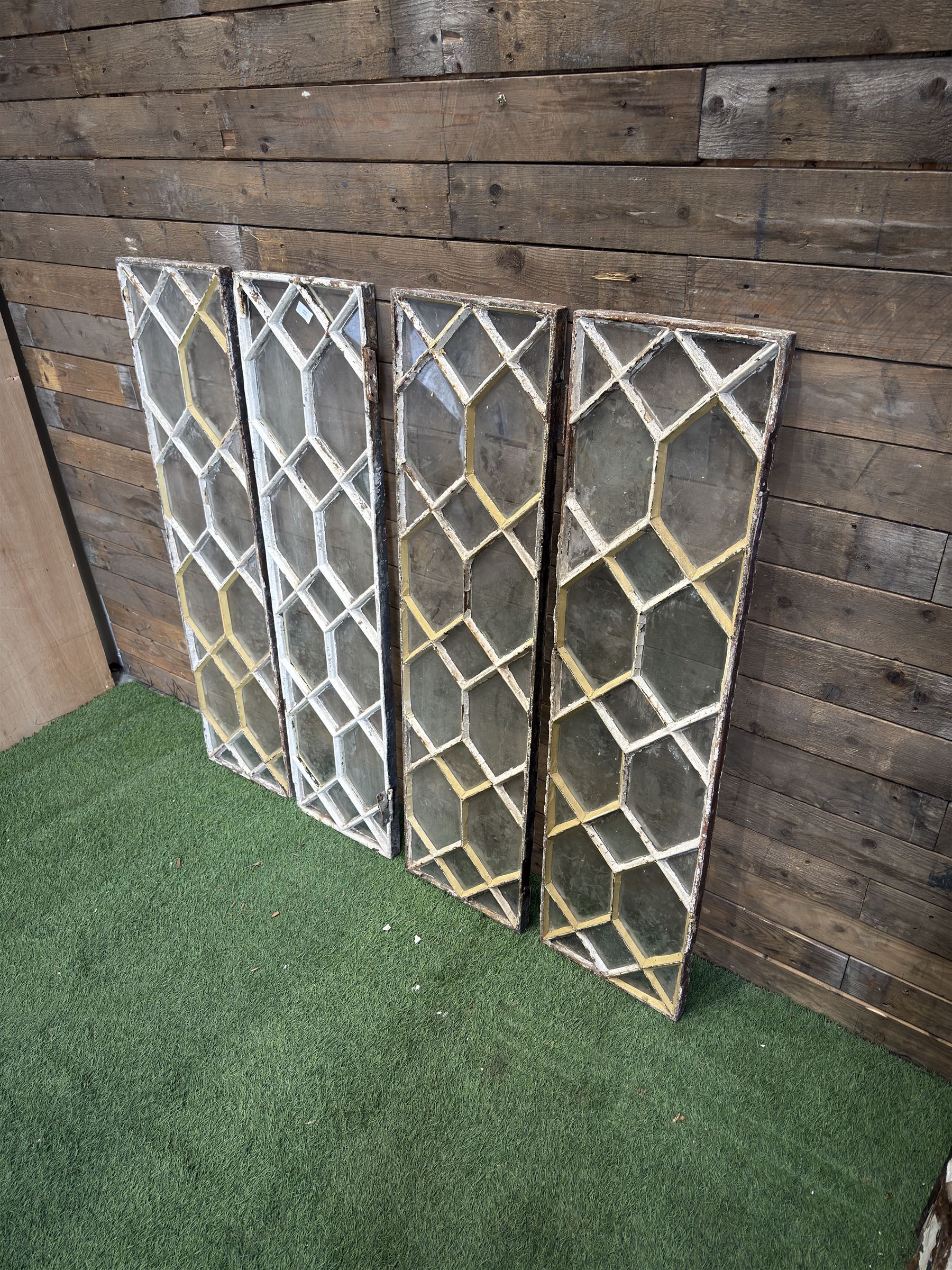 Four 19th century cast iron windows, lattice glazed in white painted finish, 