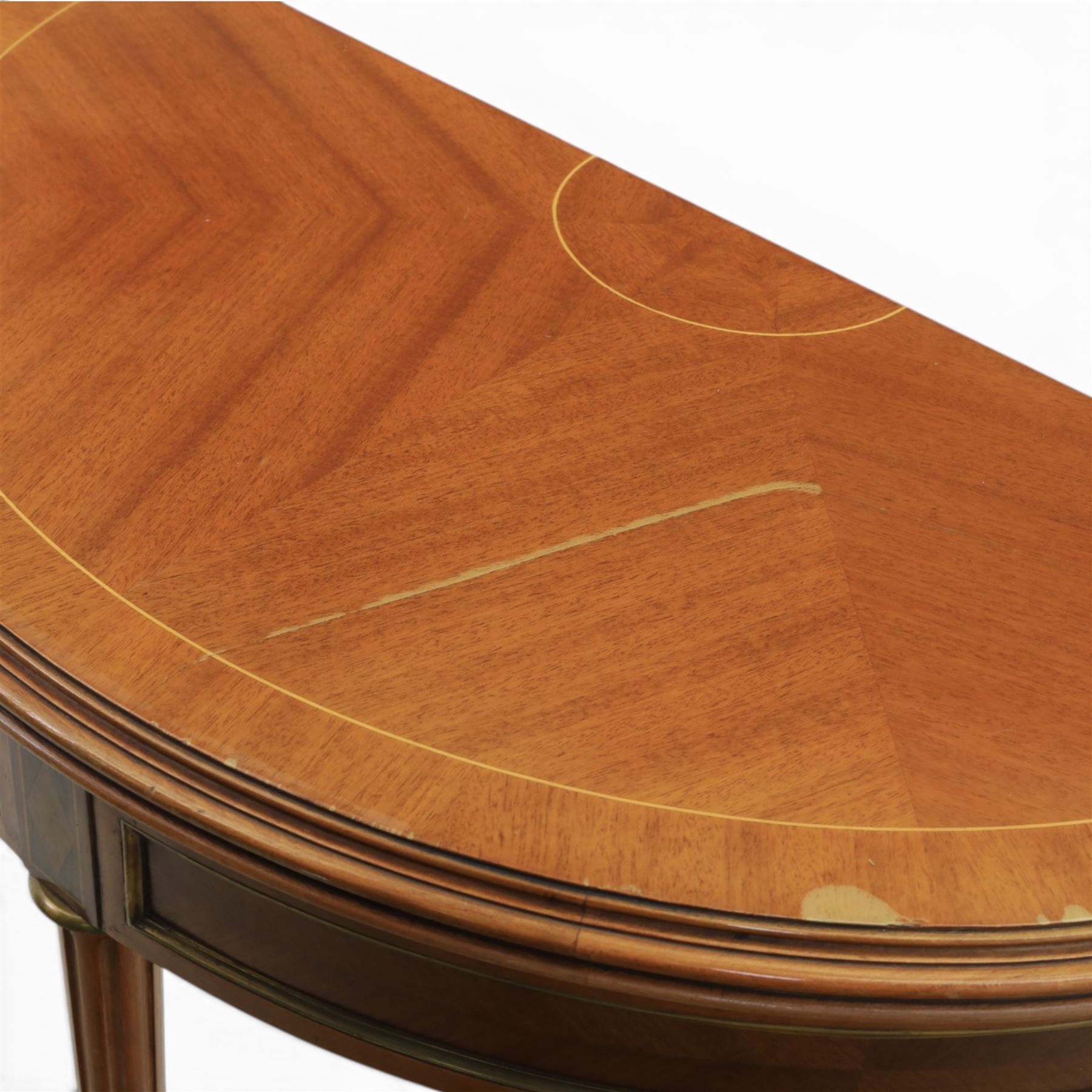 Regency revival mid 20th century walnut card table, demi lune form inlaid with boxwood, kingwood frieze with brass detail fold-over top with retractable back leg, revealing circular leather playing surface, circular tapering legs