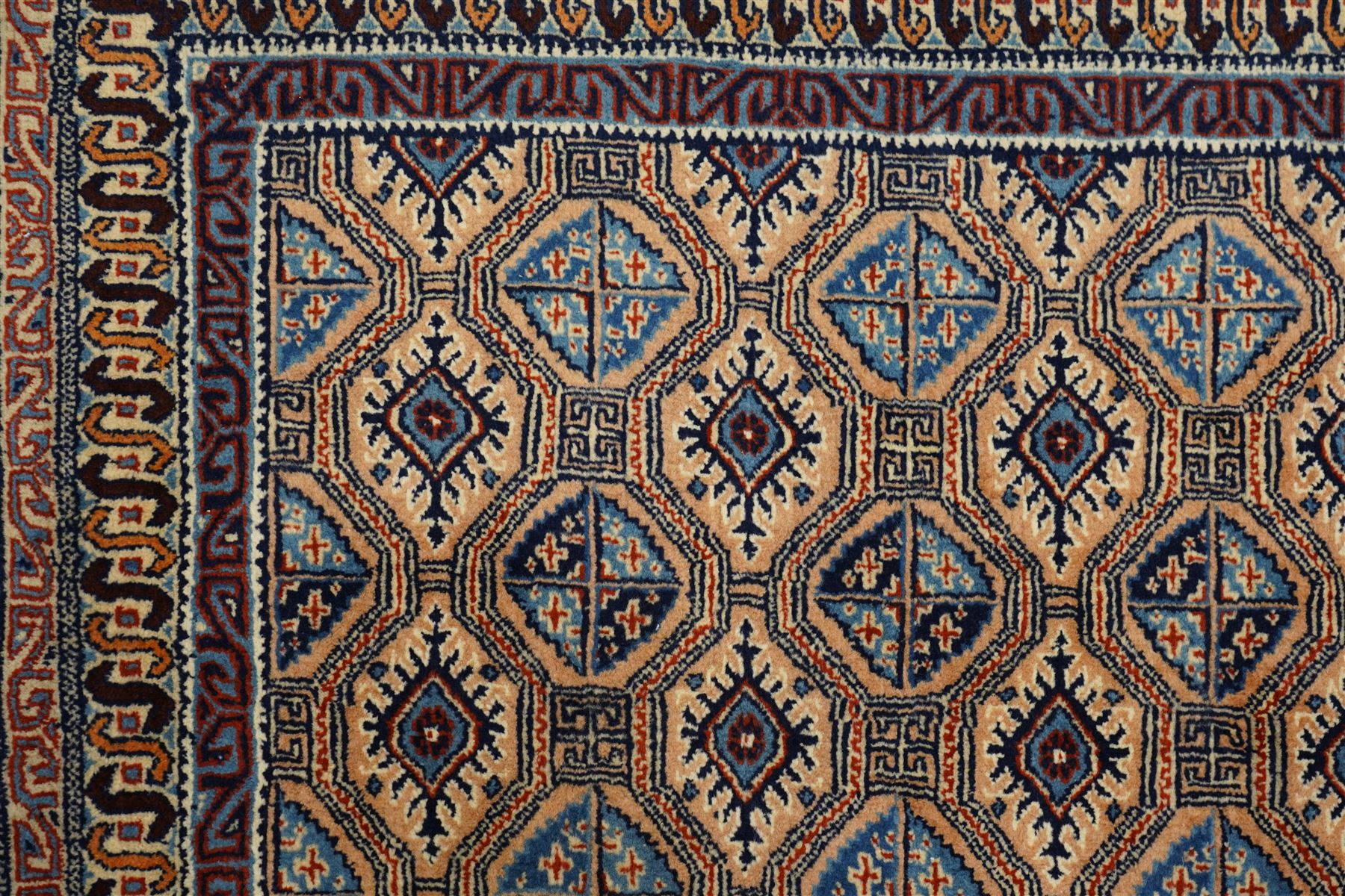 North East Persian Moud hand-knotted carpet, ivory field with an-over Herati inspired lattice of repeating lozenge and diamond motifs, with stylized floral devices and angular vinery in tones of sky blue, indigo, madder red and camel, principal border with a sequence of stylized palmettes and angular vine motifs, framed by narrow guard stripes, with cotton fringe ends