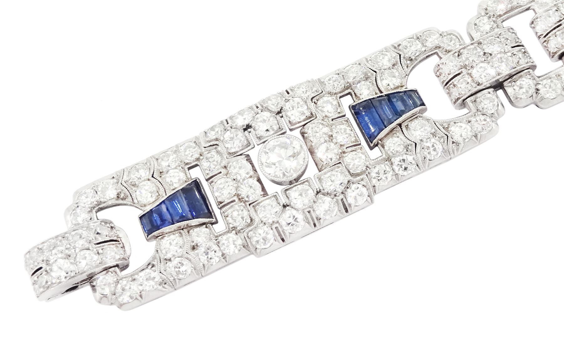 Art Deco platinum milgrain set old cut diamond and calibre cut Burmese sapphire link bracelet, the three principal diamonds each approx 0.50 carat, total diamond weight approx 13.00 - 14.00 carat, stamped Pt, circa 1925, in fitted box by Licht & Morrison, London