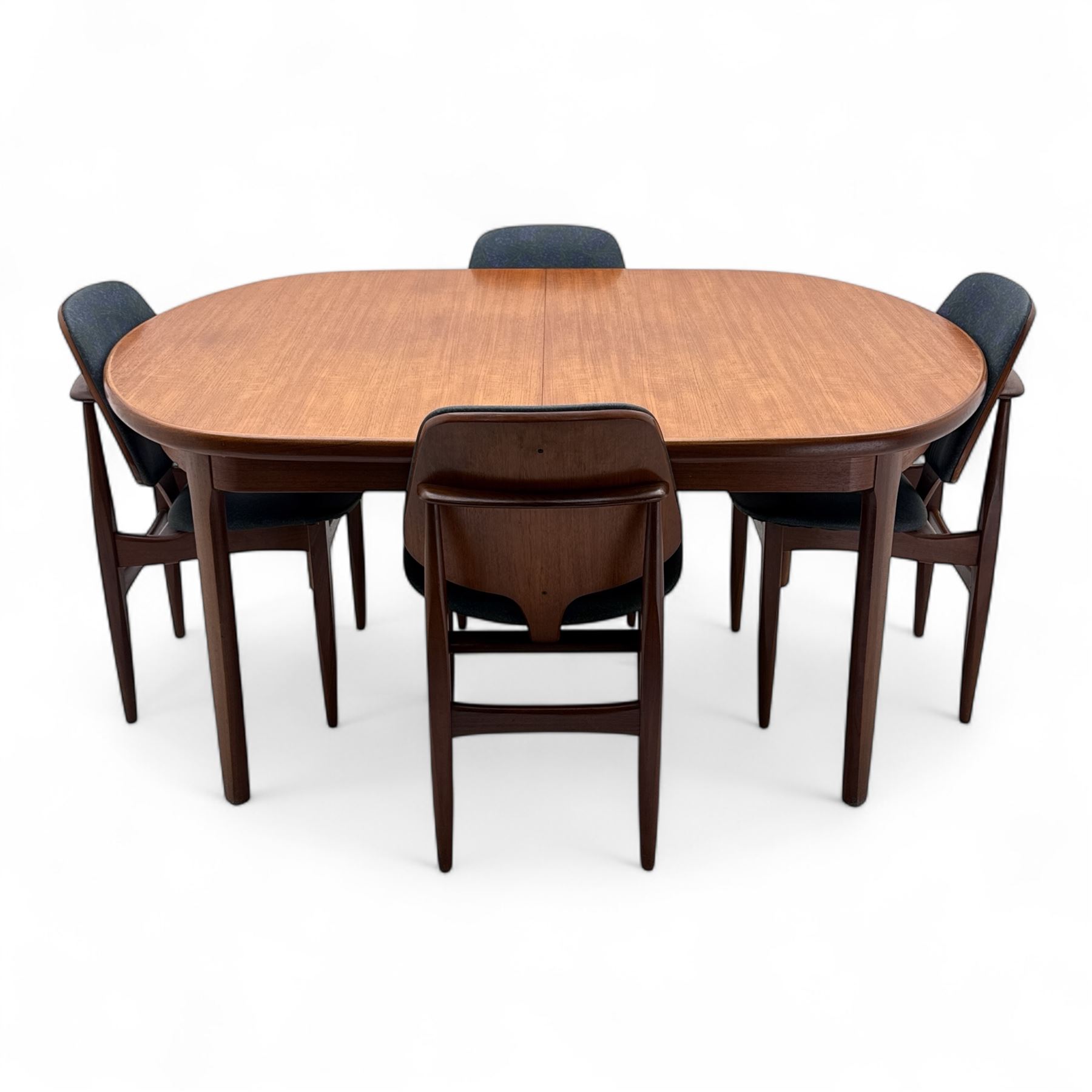 G-Plan - mid-20th century teak oval dining table, with butterfly leaf extension mechanism and four Elliot's of Newbury teak framed dining chairs upholstered in purple and green fabric, table un-extended width 152cm x depth 152cm x height 71cm, chairs 47x37x78cm 