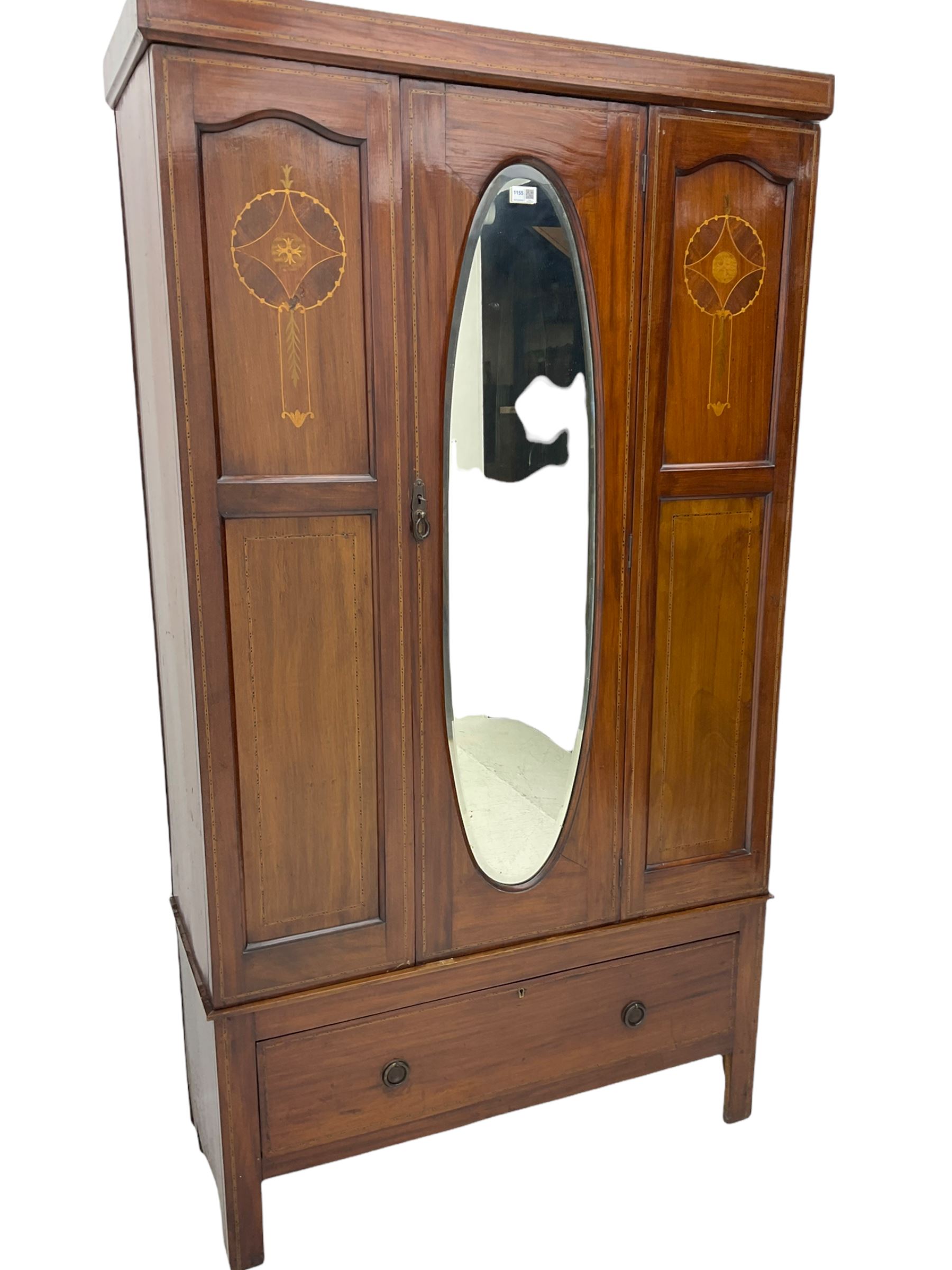 Edwardian inlaid mahogany wardrobe, oval mirror door, single drawer to base