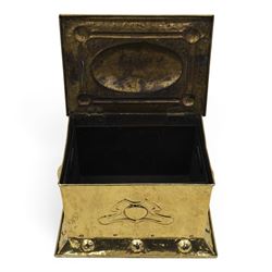 Art Nouveau brass coal box, the hinged rectangular cover embossed with a foliate design, hammered panelled sides with shaped carrying handles, on projecting plinth base with applied roundels