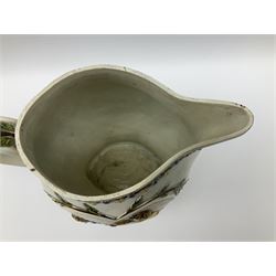 Early 19th century Prattware jug, circa 1800, decorated with two heart shaped panels of children, titled Sportive Innocence and Mischievous Sport, further decorated with acanthus and foliate borders, H22cm