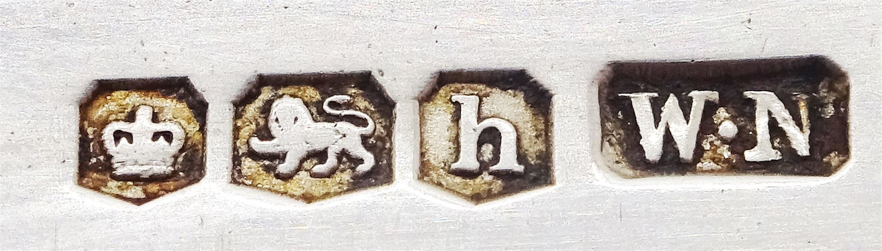 20th century silver fruit knife with engine turned decoration, the blade and handle hallmarked William Needham, Sheffield 1925, together with an Edwardian silver and mother of pearl fruit knife, the handle with engraved detail, the blade hallmarked John Yeomans Cowlishaw, Sheffield 1906, and two late Victorian silver and mother of pearl button hooks, hallmarked Arthur Worral Staniforth, Sheffield 1893 and William Needham, Sheffield 1900, (4)