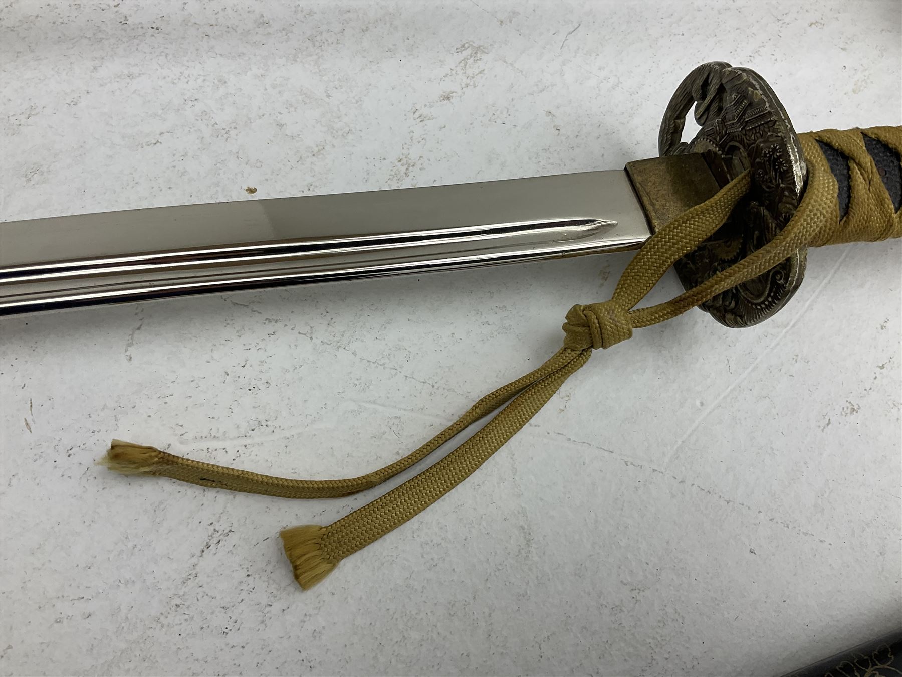 Reproduction Japanese katana with 63cm slightly curving fullered steel blade, ornate tsuba, cord bound grip and gilt transferred black saya L92cm; and two fencing foils, one marked Leon Paul (3)