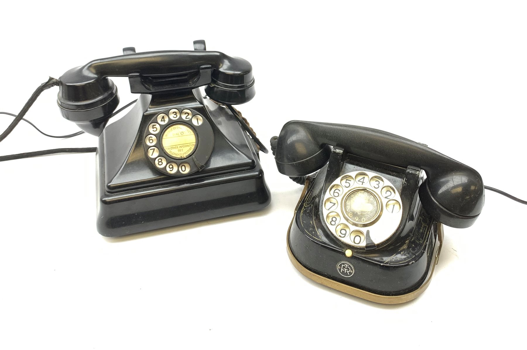  A Vintage black Bakelite telephone, together with another vintage metal bodied example with Bakelite receiver, marked Bell.   