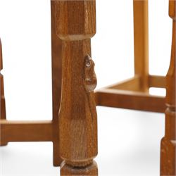 Mouseman - set of six (4+2) oak dining chairs, pierced and carved lattice back over leather upholstered seat, on octagonal front supports united by stretchers, carved with mouse signature, by the workshop of Robert Thompson, Kilburn