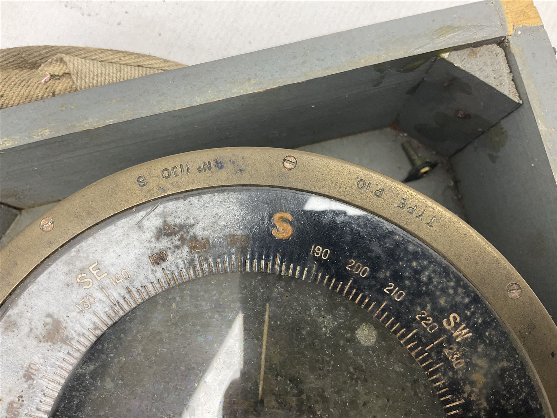  WWII period Type P10 aircraft compass, 16.5cm diameter brass rim marked “Type P10” and “No 1130B”, spring mounted onto brass base with Air Ministry plate marked “Crown A.M. No 6A.1671”; in original grey painted wooden box