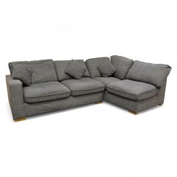 Contemporary grey fabric corner sofa and ottoman, comprising modular sections with removable back and seat cushions, raised on light wood block feet